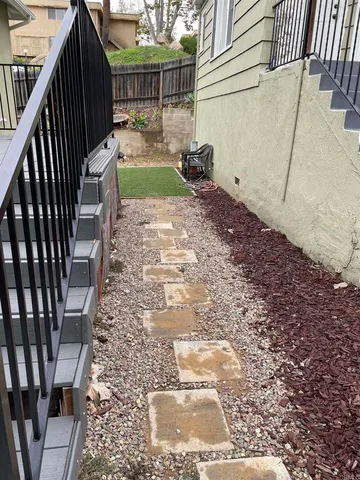 a view of empty room with wooden floor and floor to ceiling window