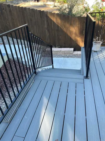 a view of balcony with wooden floor