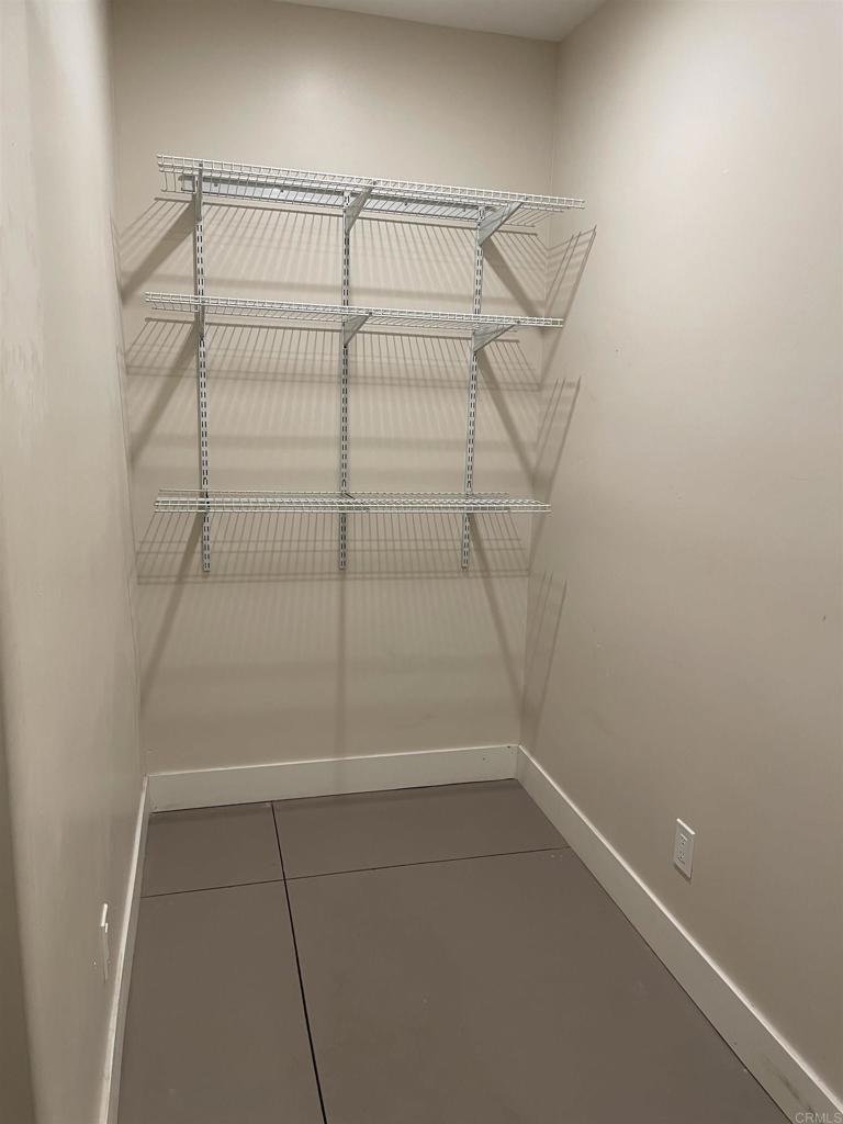 8545 Lemon Avenue, Unit 1 La Mesa, CA 91941 - Photo 27 of 28 a view of a room with racks on the wall