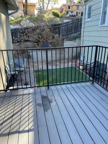 a view of balcony with wooden floor