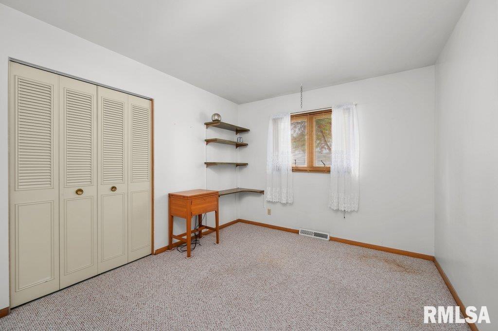 513 12th Avenue Hampton, IL 61256 - Photo 14 of 35 an empty room with a window