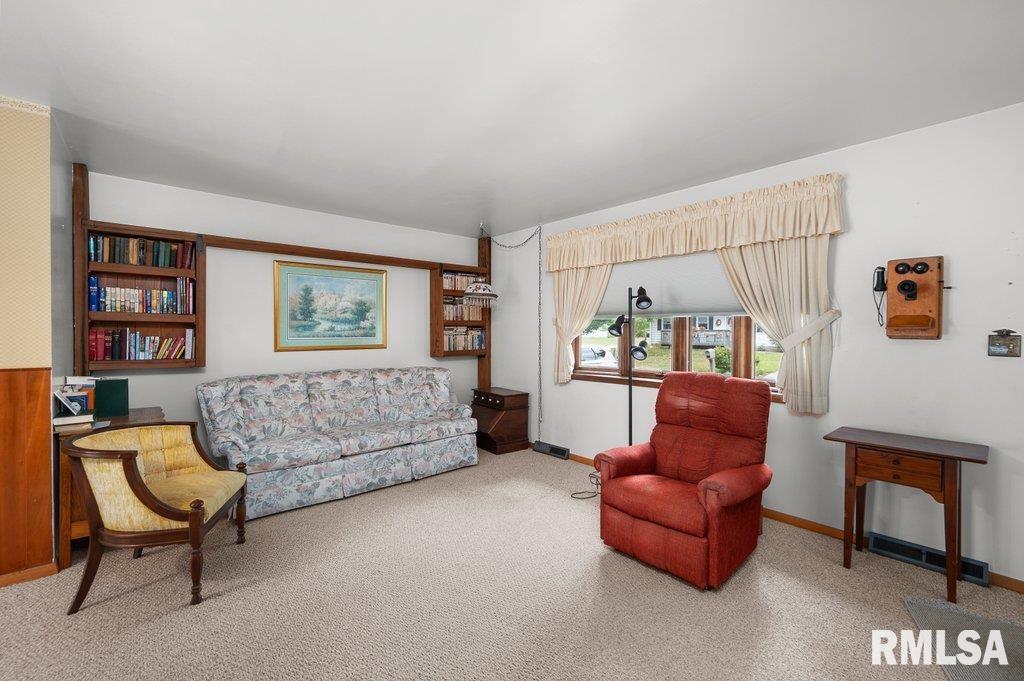 513 12th Avenue Hampton, IL 61256 - Photo 2 of 35 a living room with furniture and a couch