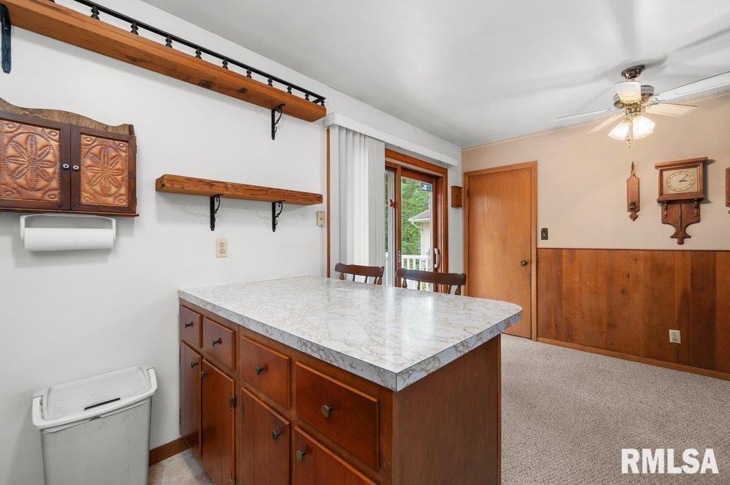 513 12th Avenue Hampton, IL 61256 - Photo 10 of 35 a room with a table and chairs