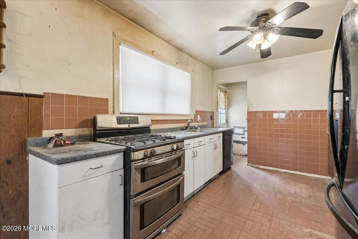 355 Toms River Road Jackson, NJ 08527 - Photo 14 of 21 a kitchen with stainless steel appliances granite countertop a stove a sink and a refrigerator