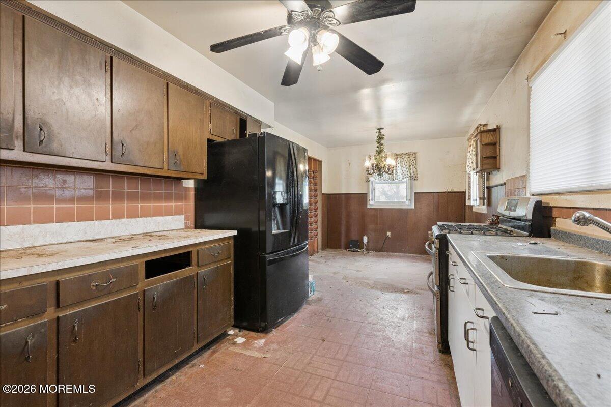 355 Toms River Road Jackson, NJ 08527 - Photo 15 of 21 a kitchen with a sink stainless steel appliances and chandelier
