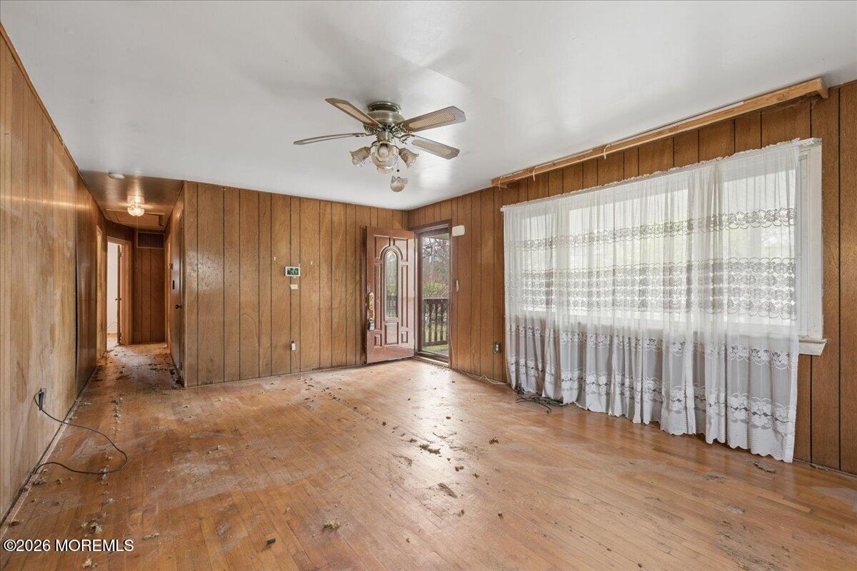 355 Toms River Road Jackson, NJ 08527 - Photo 6 of 21 a view of a livingroom with a ceiling fan and window