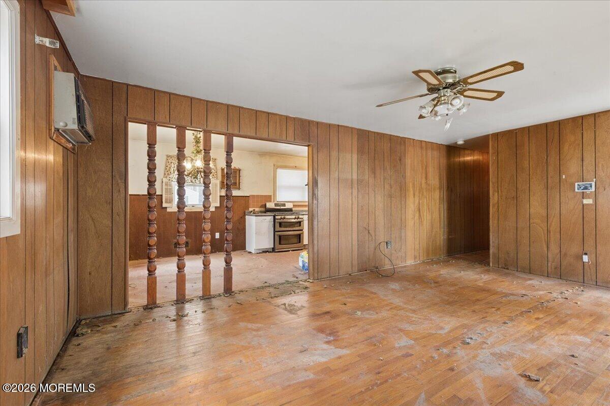 355 Toms River Road Jackson, NJ 08527 - Photo 7 of 21 a view of a livingroom with a chandelier fan and wooden floor