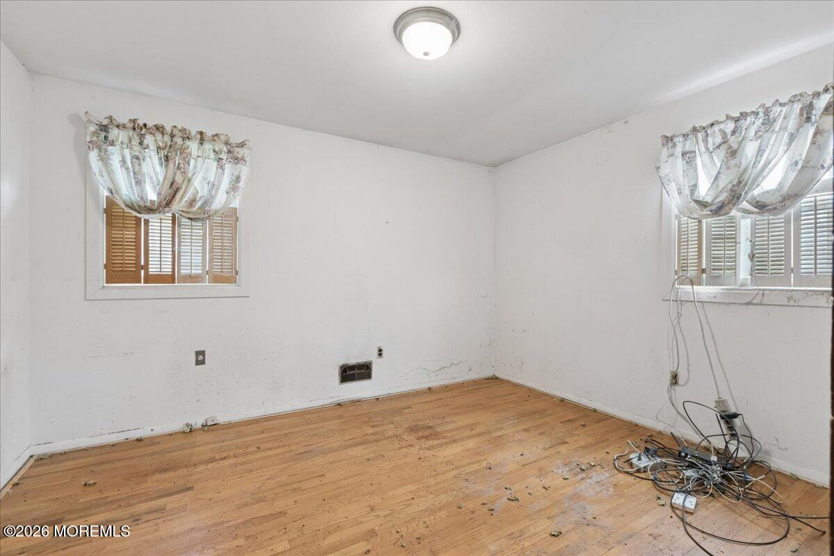 355 Toms River Road Jackson, NJ 08527 - Photo 9 of 21 a view of a livingroom with wooden floor and a window