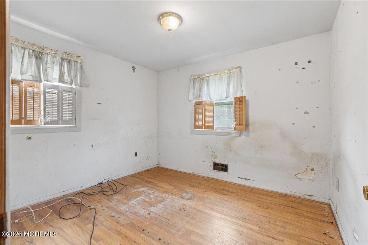 355 Toms River Road Jackson, NJ 08527 - Photo 10 of 21 a view of empty room with wooden floor