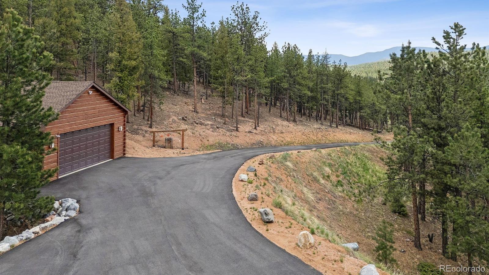 2894 County Road 43 Bailey, CO 80421 - Photo 2 of 40 a view of a house with a backyard