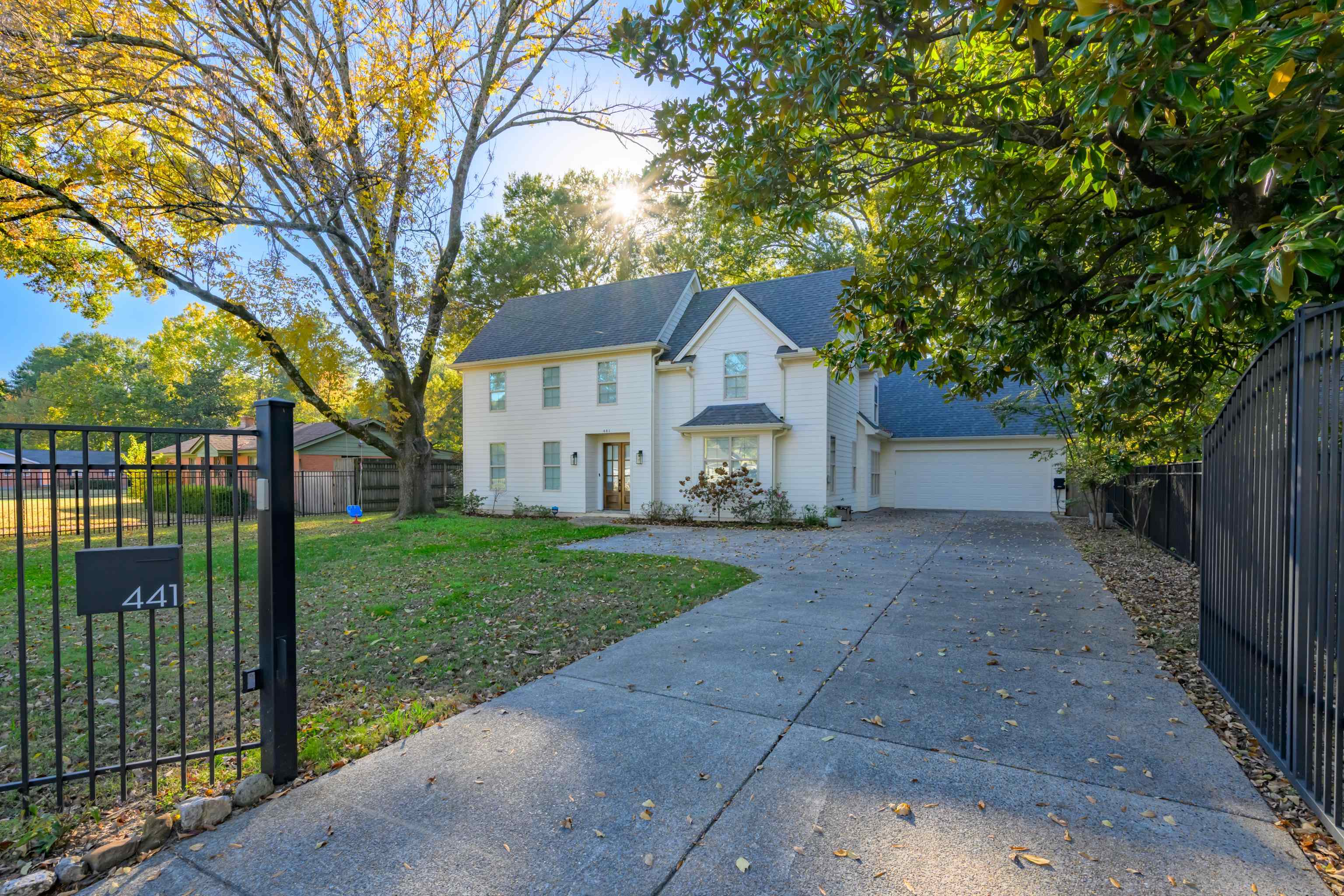 a view of a house with a yard