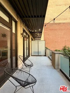 a view of balcony with furniture