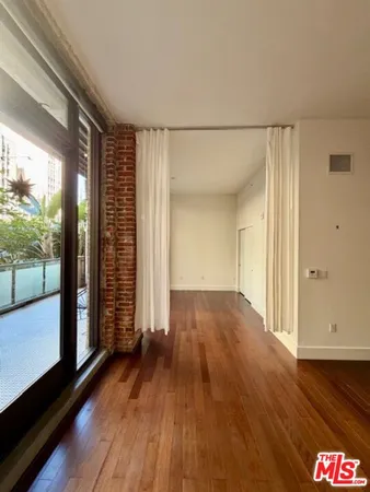 a view of gallery with wooden floor