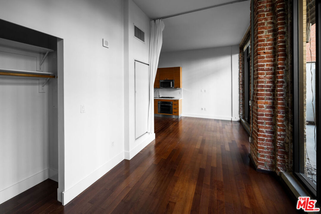 460 South Spring Street, Unit 205 Los Angeles, CA 90013 - Photo 7 of 21 a view of a kitchen from the hallway