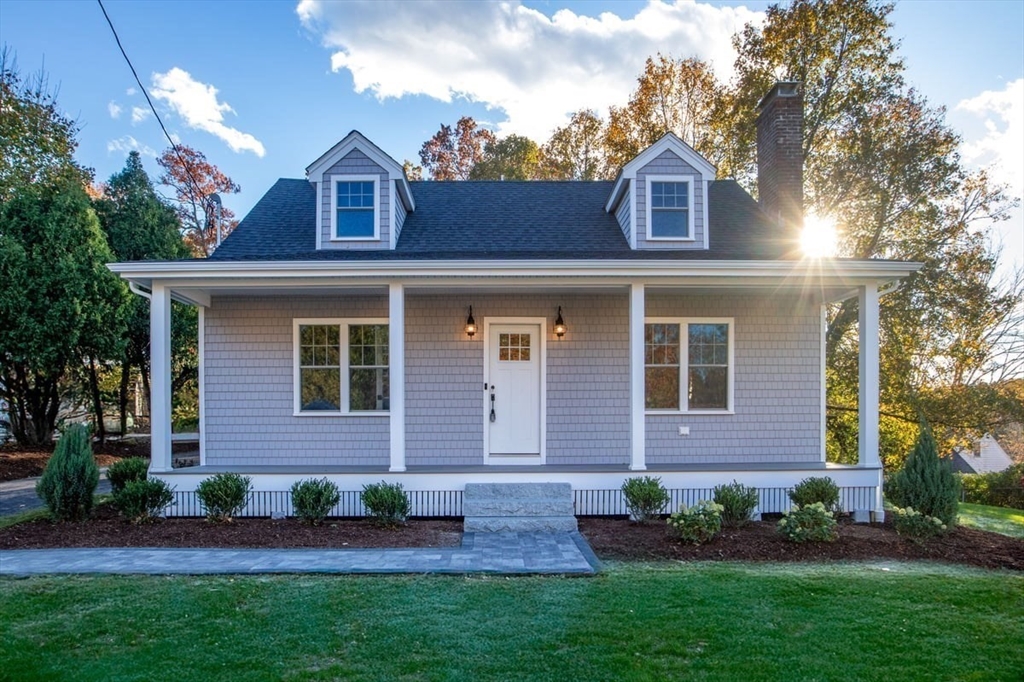 front view of a house with a yard