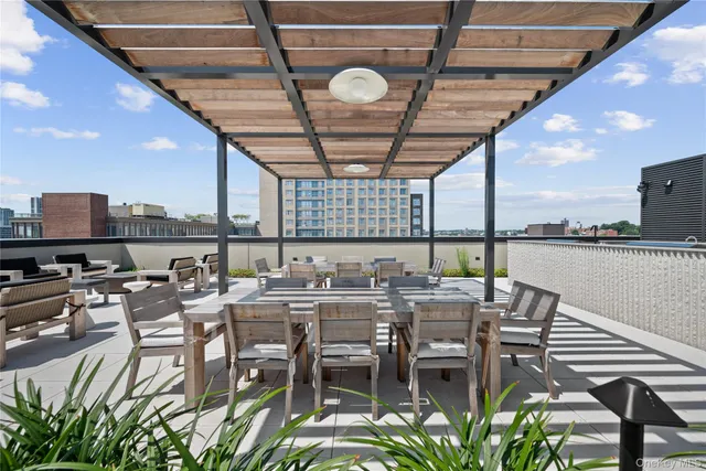 a terrace with a table and chairs