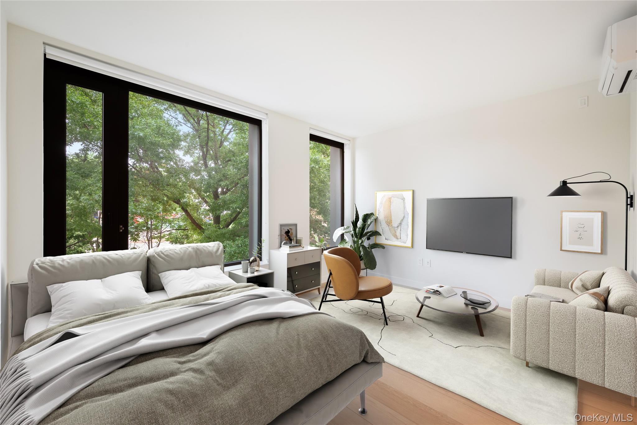 15310-unit #804 15310-unit Avenue Queens, NY 11432 - Photo 4 of 19 a bedroom with a bed and large windows