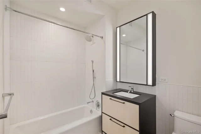 a view of a kitchen with a washer and dryer