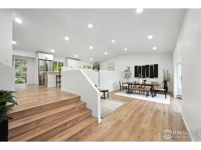 a view of a living room and a livingroom with furniture wooden floor
