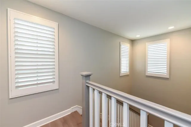 a view of hallway with windows