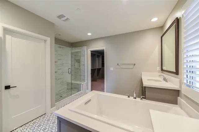 a bathroom with a bathtub and a sink