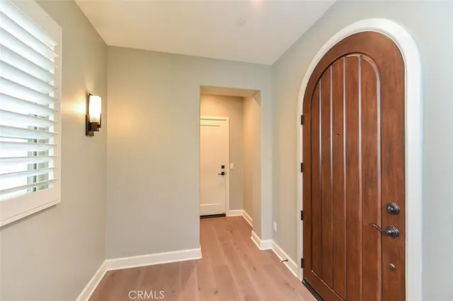 a view of front door with wooden floor