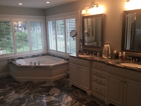 3 Fairbanks Road Lexington, MA 02421 - Photo 13 of 18 a bath room with a sink and a mirror