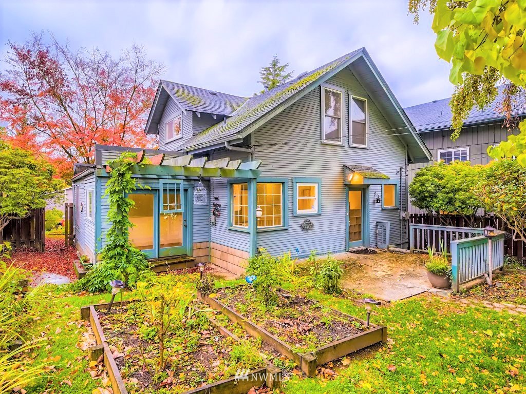 10308 Northeast 186th Street Bothell, WA 98011 - Photo 1 of 25 a front view of a house with swimming pool