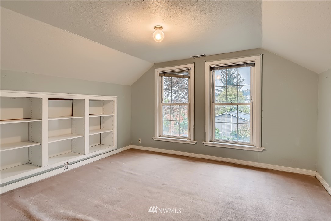 10308 Northeast 186th Street Bothell, WA 98011 - Photo 12 of 25 an empty room with windows and cabinet