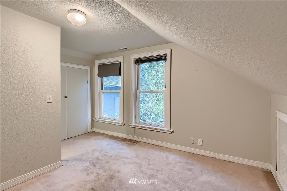 10308 Northeast 186th Street Bothell, WA 98011 - Photo 13 of 25 an empty room with windows and closet