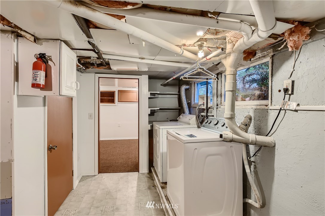 10308 Northeast 186th Street Bothell, WA 98011 - Photo 17 of 25 a view of a storage & utility room with dryer and washer