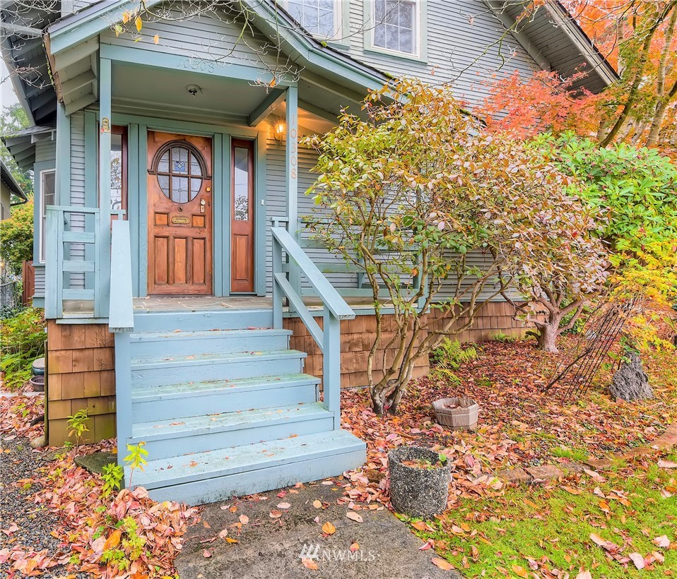 10308 Northeast 186th Street Bothell, WA 98011 - Photo 5 of 25 a front view of a house with a yard and potted plants