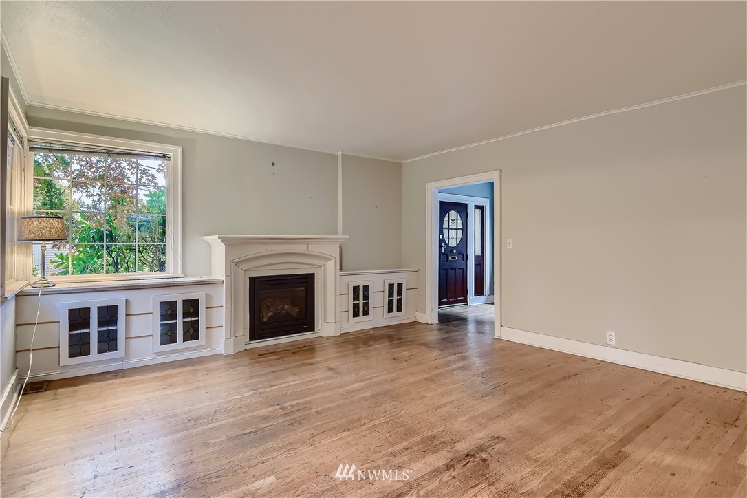 10308 Northeast 186th Street Bothell, WA 98011 - Photo 6 of 25 a view of a livingroom with an empty space and a fireplace