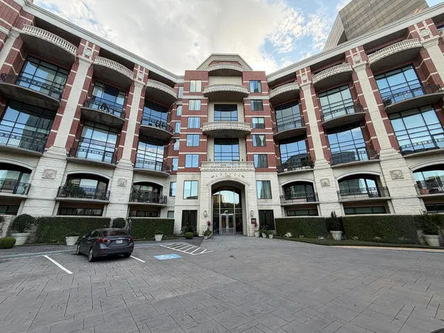 front view of a brick building with many windows