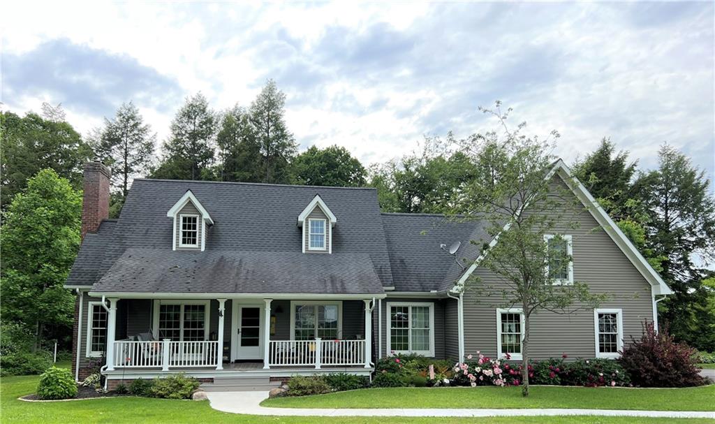 1673 Methodist Road Greenville, PA 16125 - Photo 1 of 25 a front view of a house with a garden