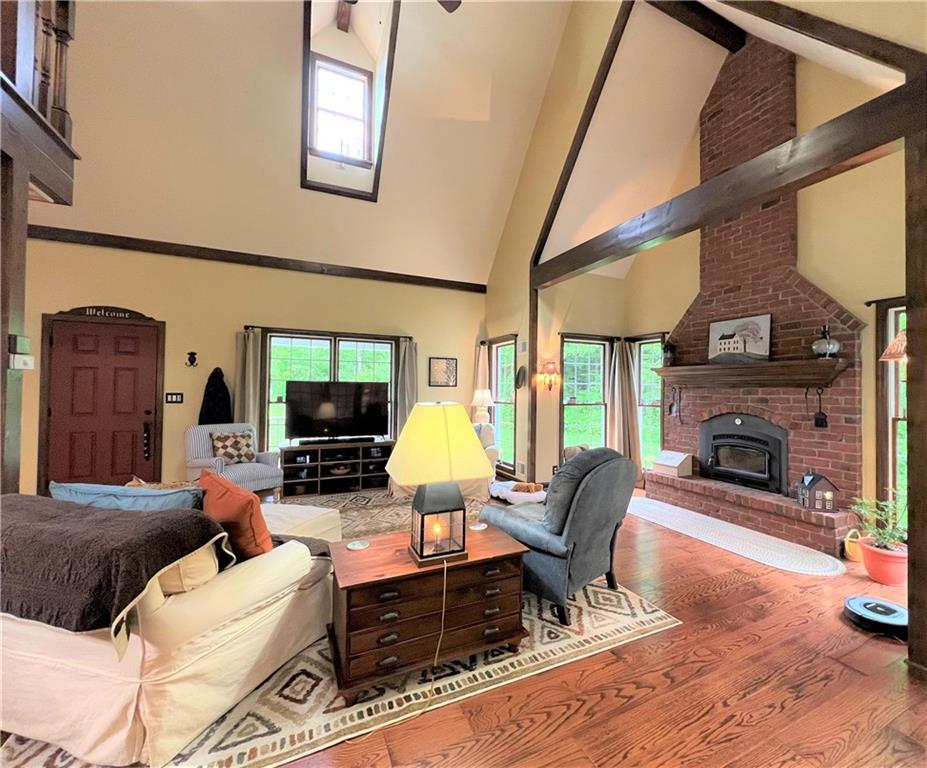 1673 Methodist Road Greenville, PA 16125 - Photo 11 of 25 a living room with furniture a flat screen tv and a fireplace