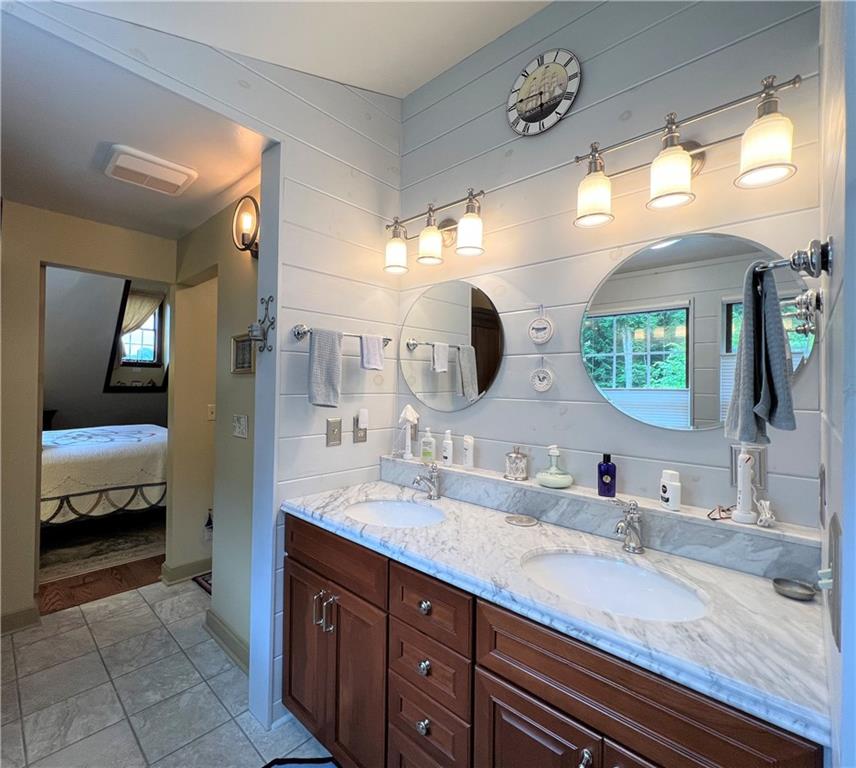 1673 Methodist Road Greenville, PA 16125 - Photo 17 of 25 a en suite bathroom with double sink and a mirror