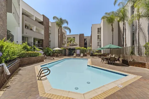 a view of swimming pool with outdoor seating