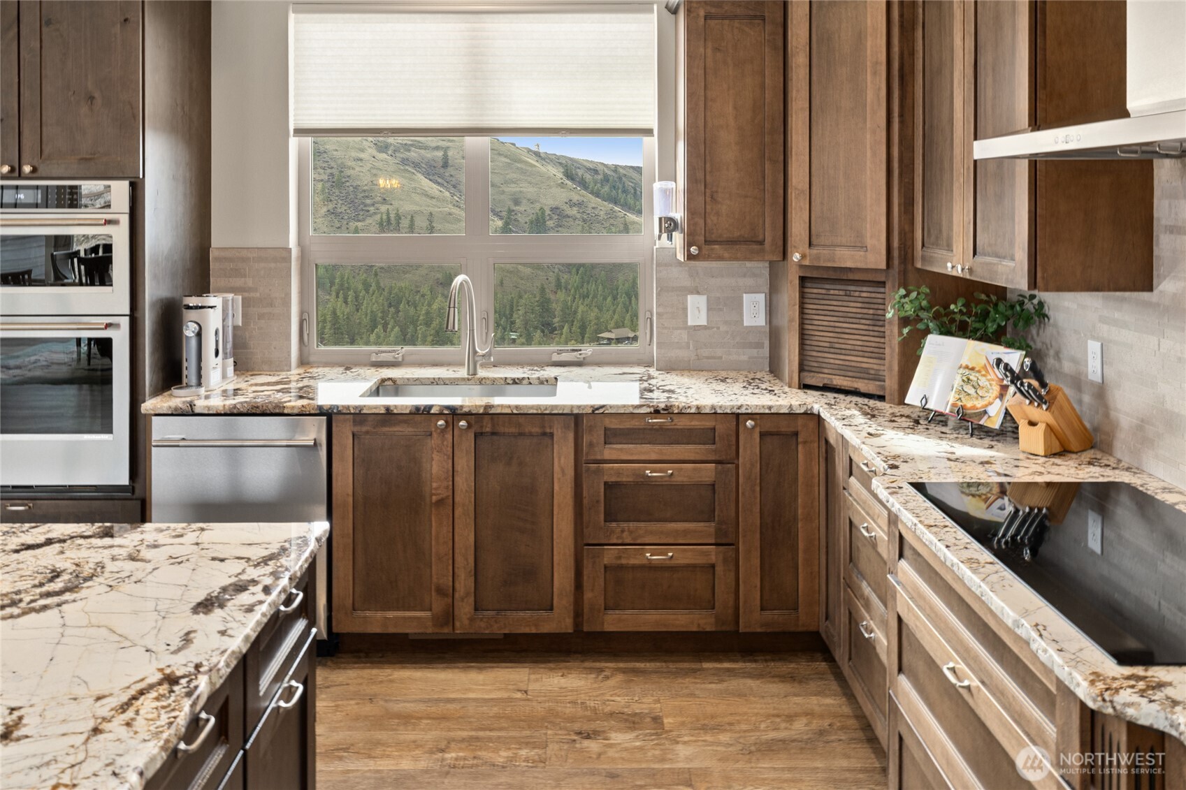 6083 Secret Canyon Road Ellensburg, WA 98926 - Photo 14 of 40 a kitchen with a sink stove and cabinets