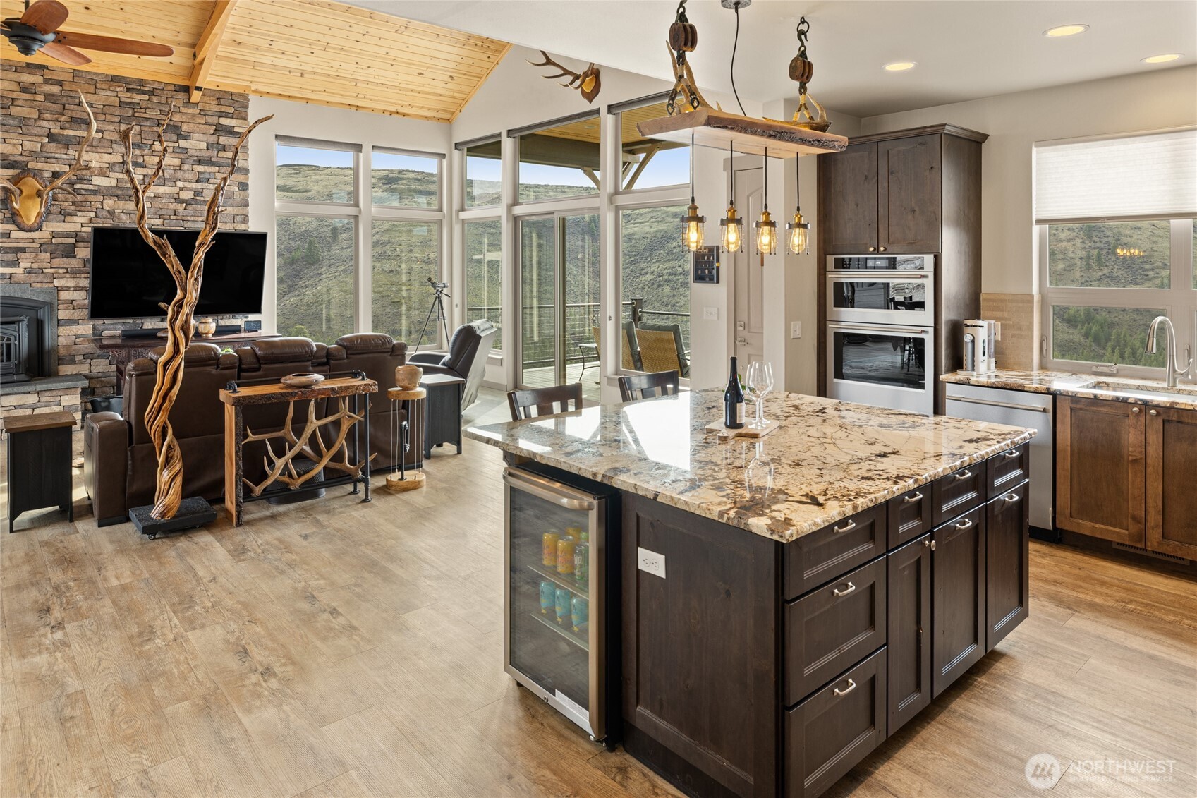 6083 Secret Canyon Road Ellensburg, WA 98926 - Photo 16 of 40 a kitchen with stainless steel appliances granite countertop a stove and a refrigerator