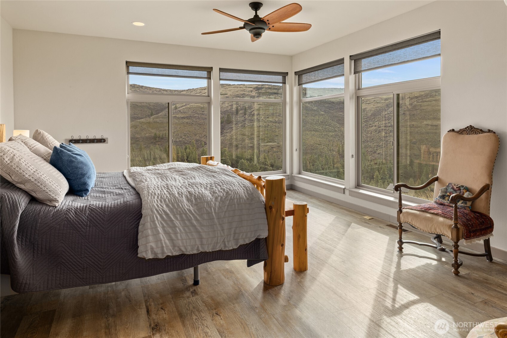 6083 Secret Canyon Road Ellensburg, WA 98926 - Photo 18 of 40 a bed sitting in a bedroom next to a window