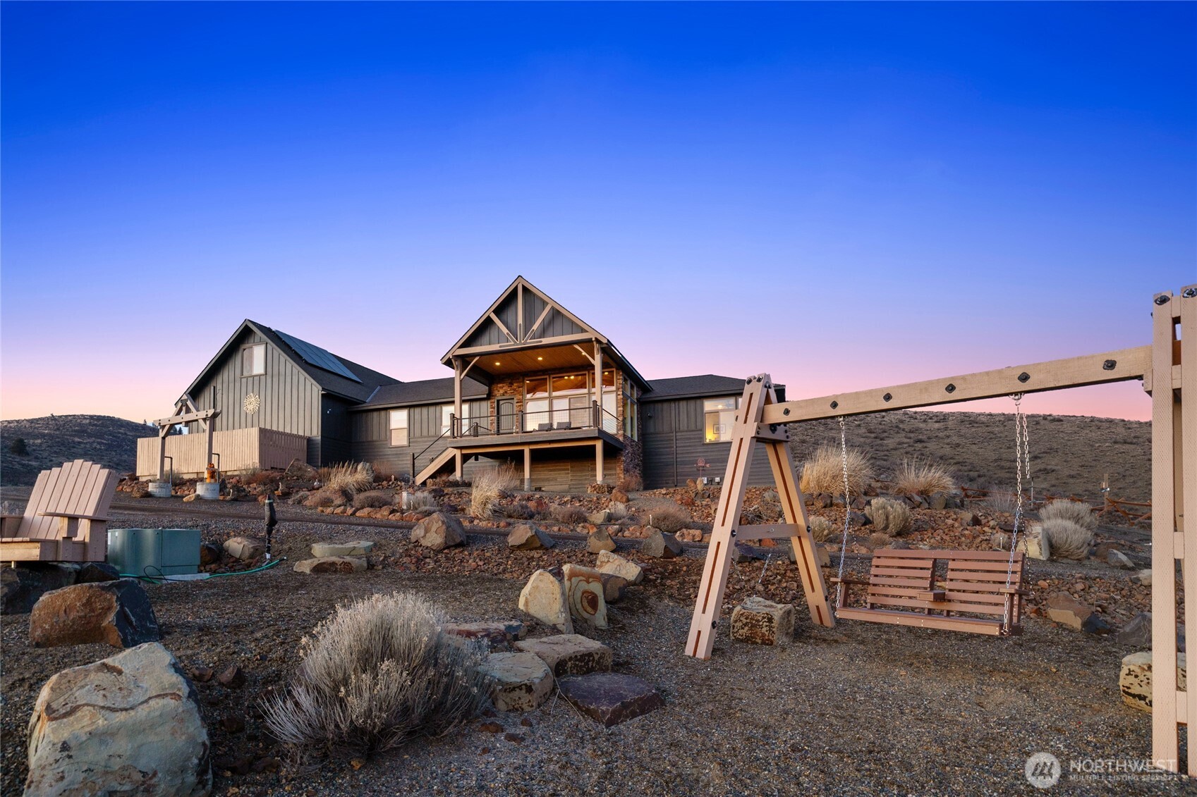 6083 Secret Canyon Road Ellensburg, WA 98926 - Photo 2 of 40 a front view of a house with a yard