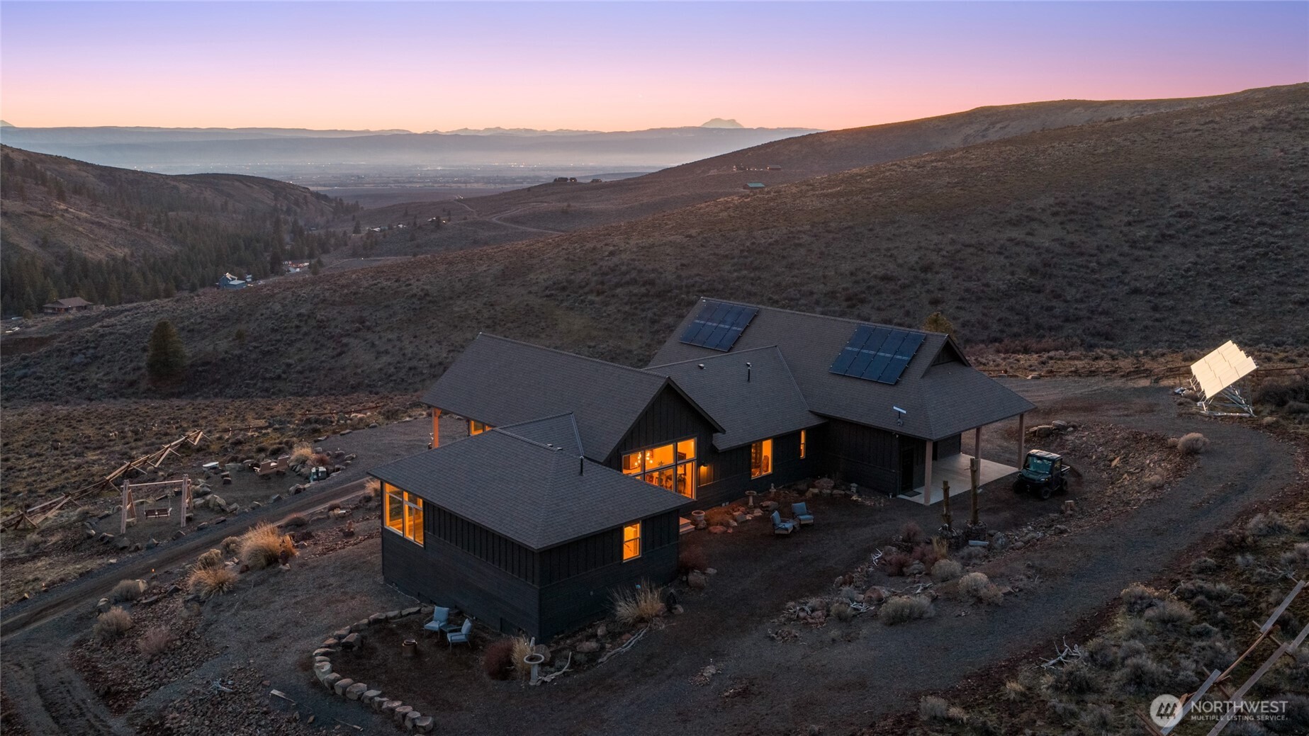 6083 Secret Canyon Road Ellensburg, WA 98926 - Photo 4 of 40 an aerial view of a house with mountain view