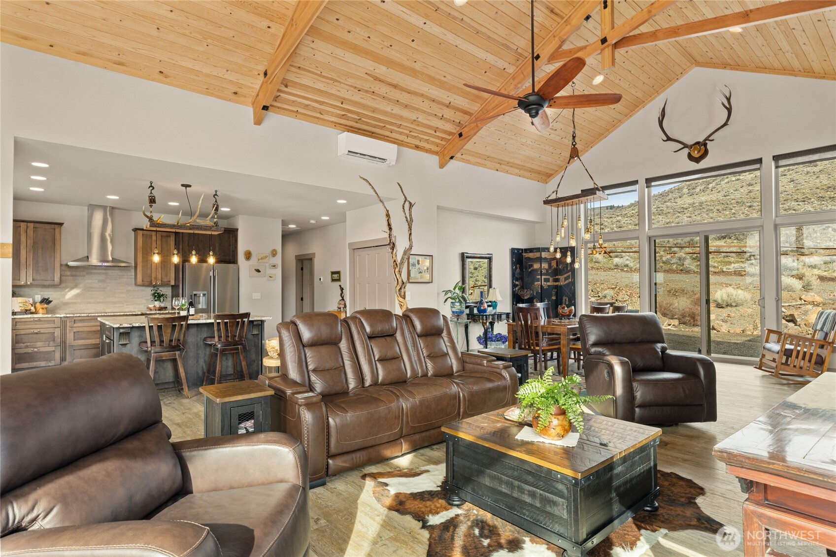 6083 Secret Canyon Road Ellensburg, WA 98926 - Photo 8 of 40 a living room with furniture kitchen view and a large window