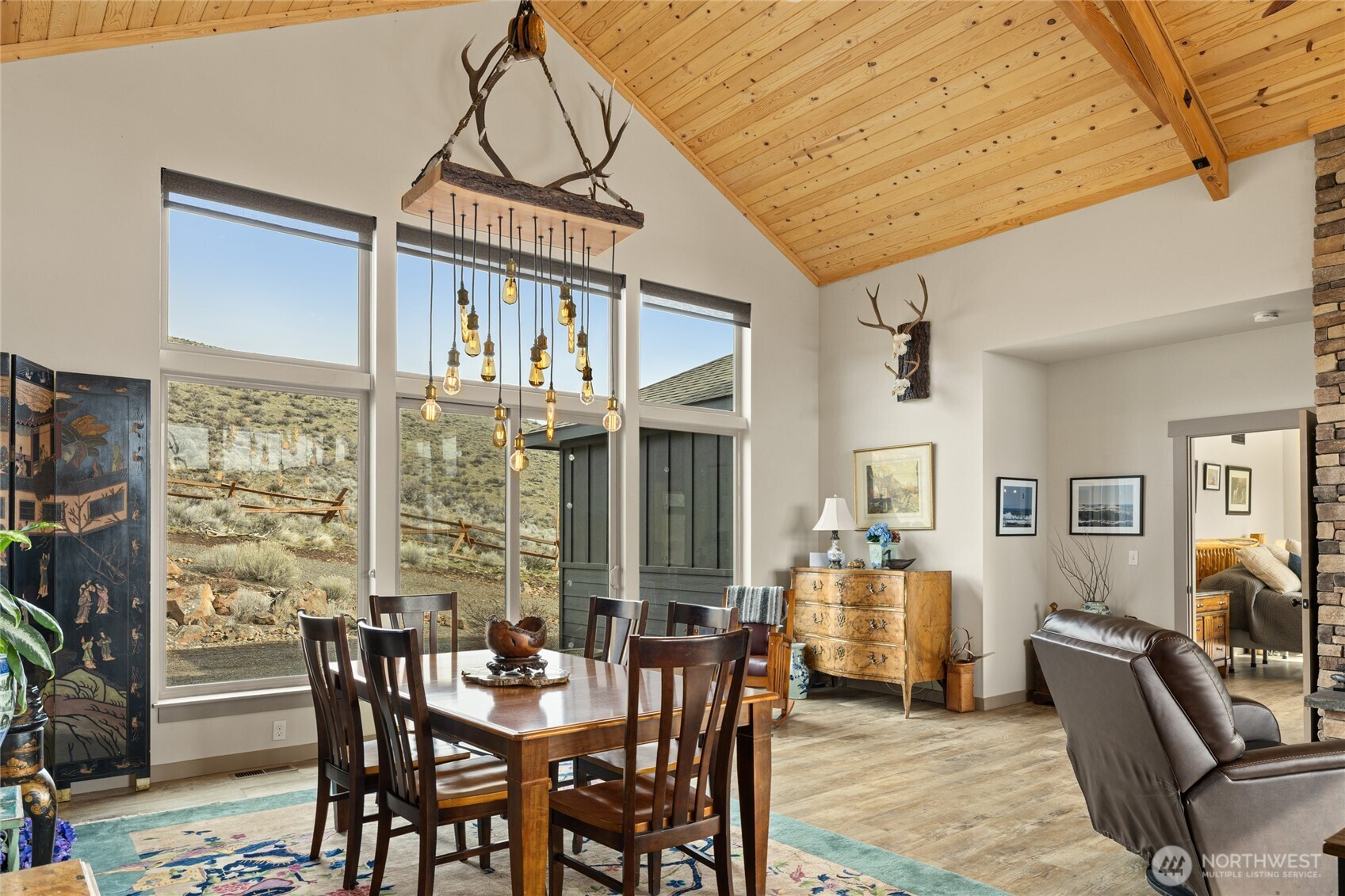 6083 Secret Canyon Road Ellensburg, WA 98926 - Photo 10 of 40 a view of a dining room with furniture window and wooden floor