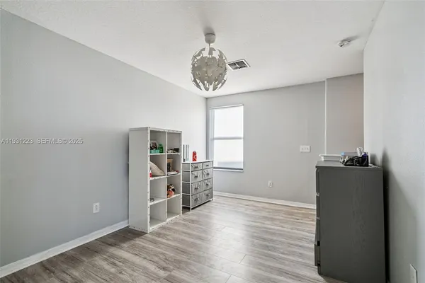 a room with window and wooden floor