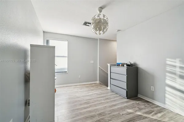 a view of a storage & utility room with a window