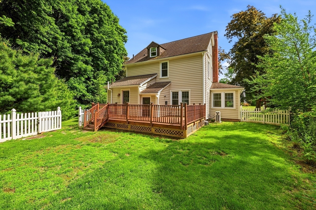 32 Lincoln Road Longmeadow, MA 01106 - Photo 4 of 36 a view of a house with a backyard and deck