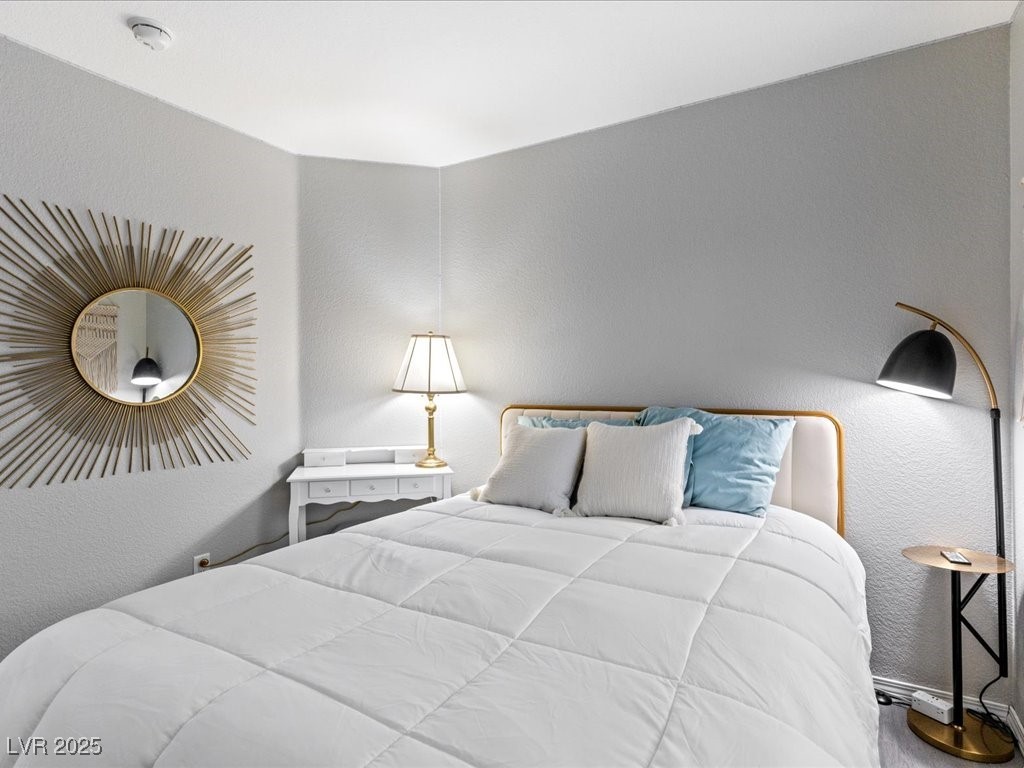 5505 Big Sky Lane Las Vegas, NV 89149 - Photo 22 of 42 Bedroom with baseboards and a textured wall