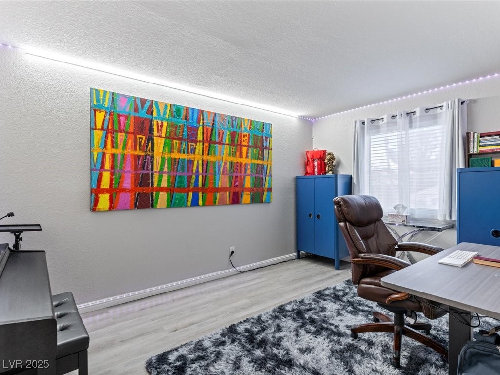 5505 Big Sky Lane Las Vegas, NV 89149 - Photo 26 of 42 Home office with baseboards, a textured ceiling, and wood finished floors